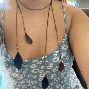 Long accent necklace with brown and blue feathers